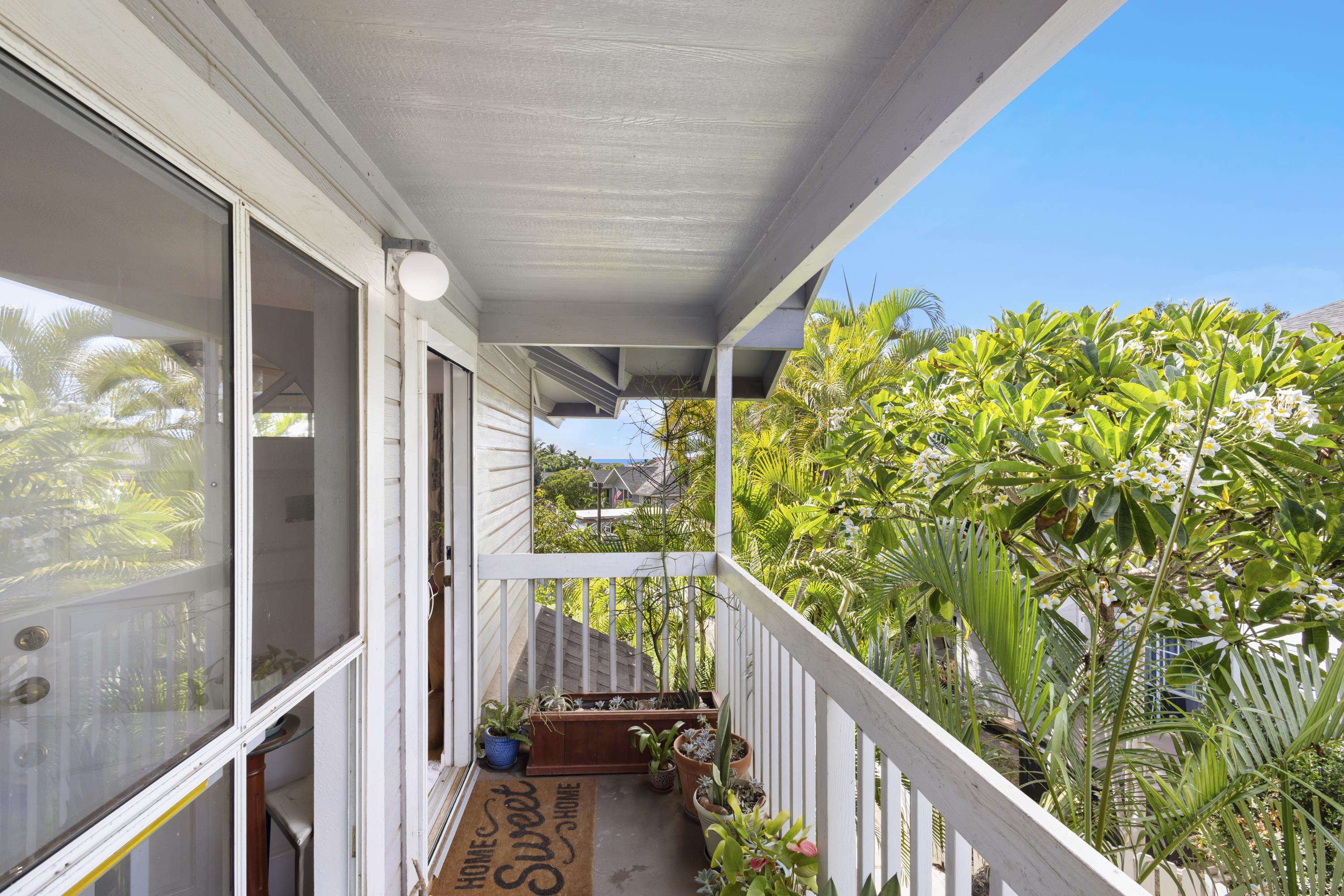 160 Keonekai Road, Unit 22201 Kihei, HI 96753 - Photo 18 of 37 a view of a balcony with floor to ceiling windows with wooden floor