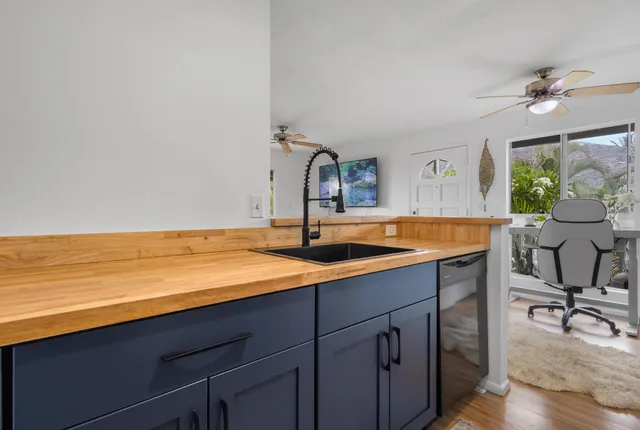a kitchen with a sink and a stove
