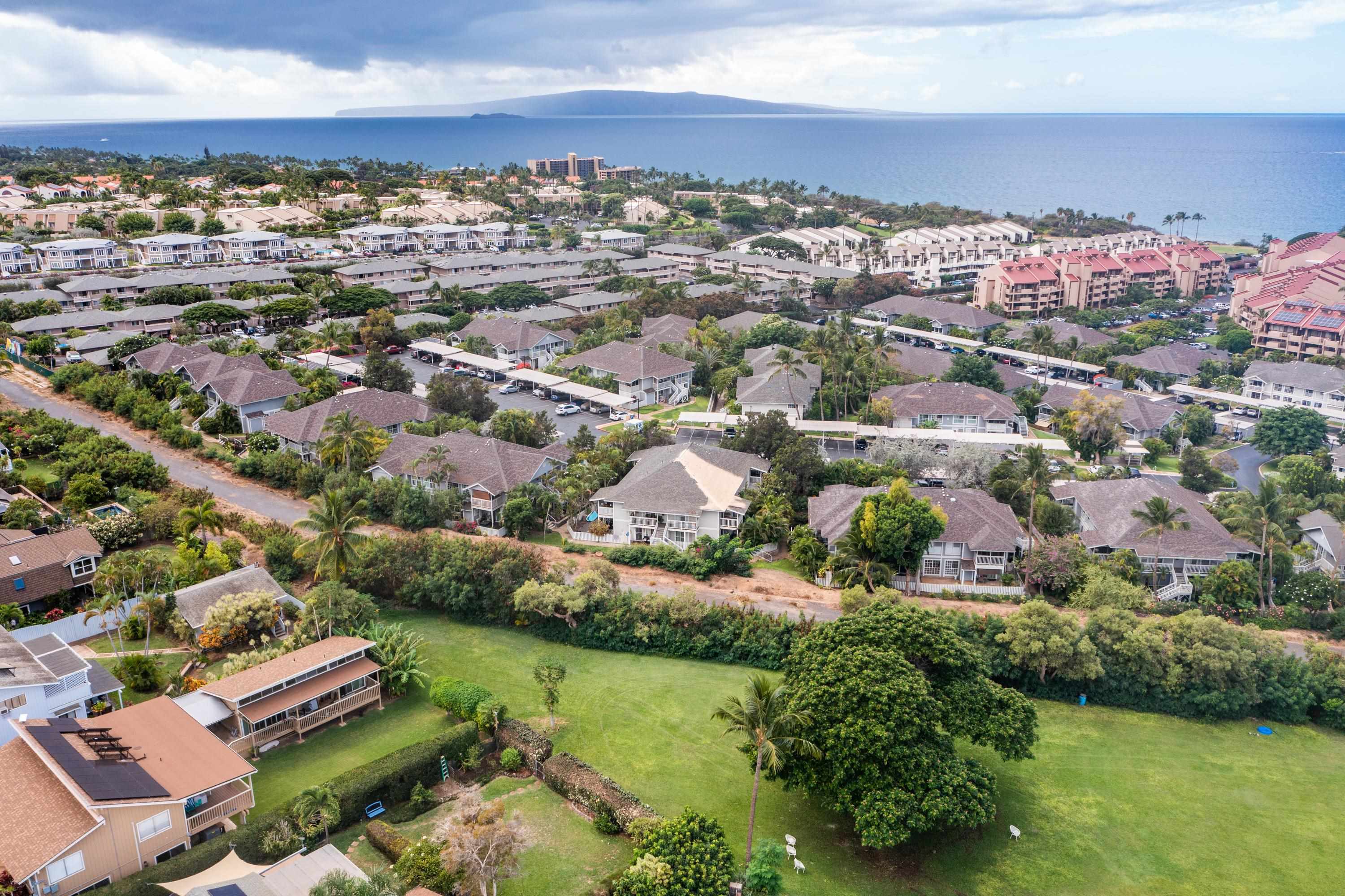160 Keonekai Road, Unit 22201 Kihei, HI 96753 - Photo 32 of 37 an aerial view of residential houses with outdoor space
