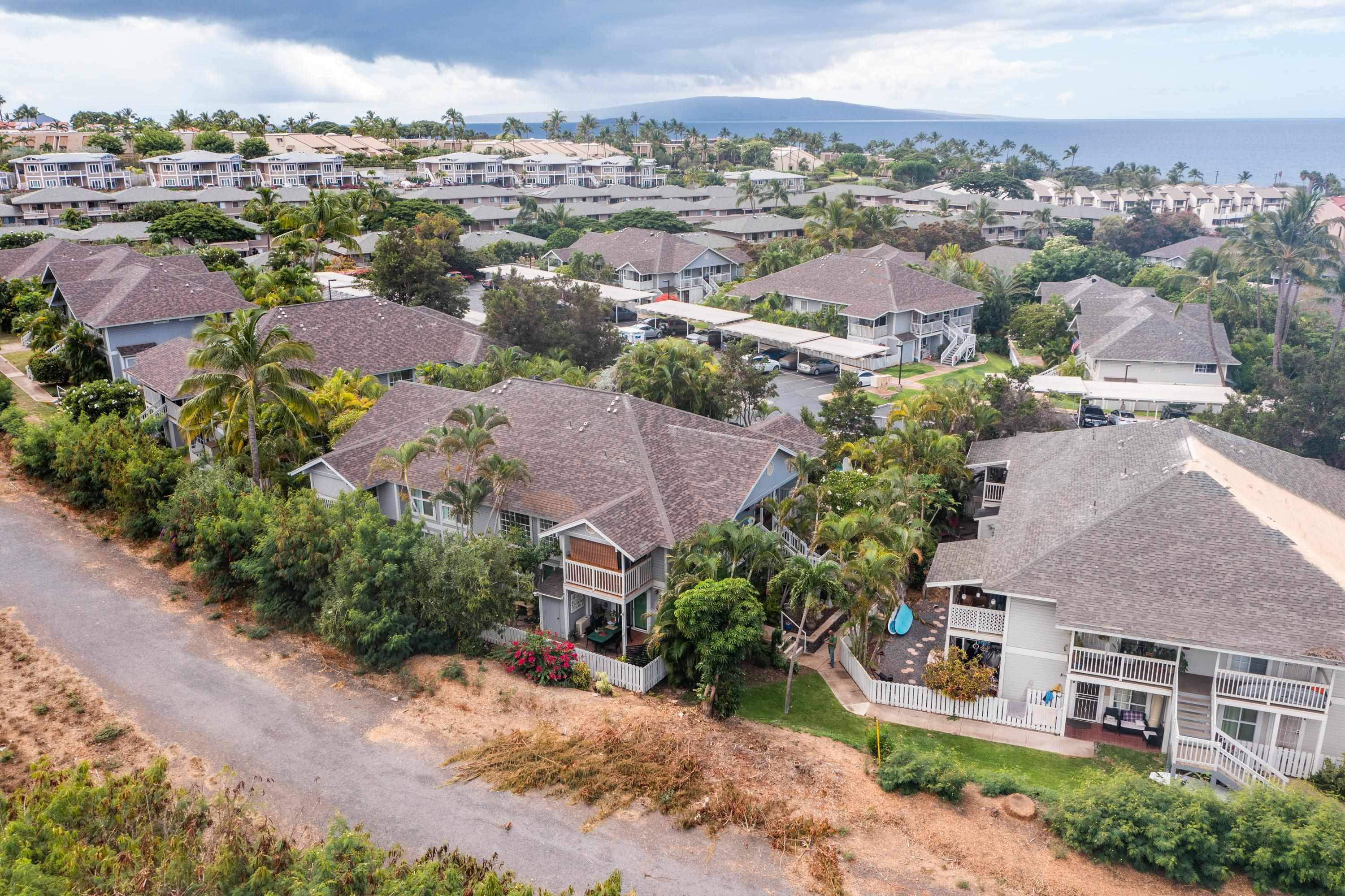 160 Keonekai Road, Unit 22201 Kihei, HI 96753 - Photo 33 of 37 an aerial view of residential houses with outdoor space and ocean view