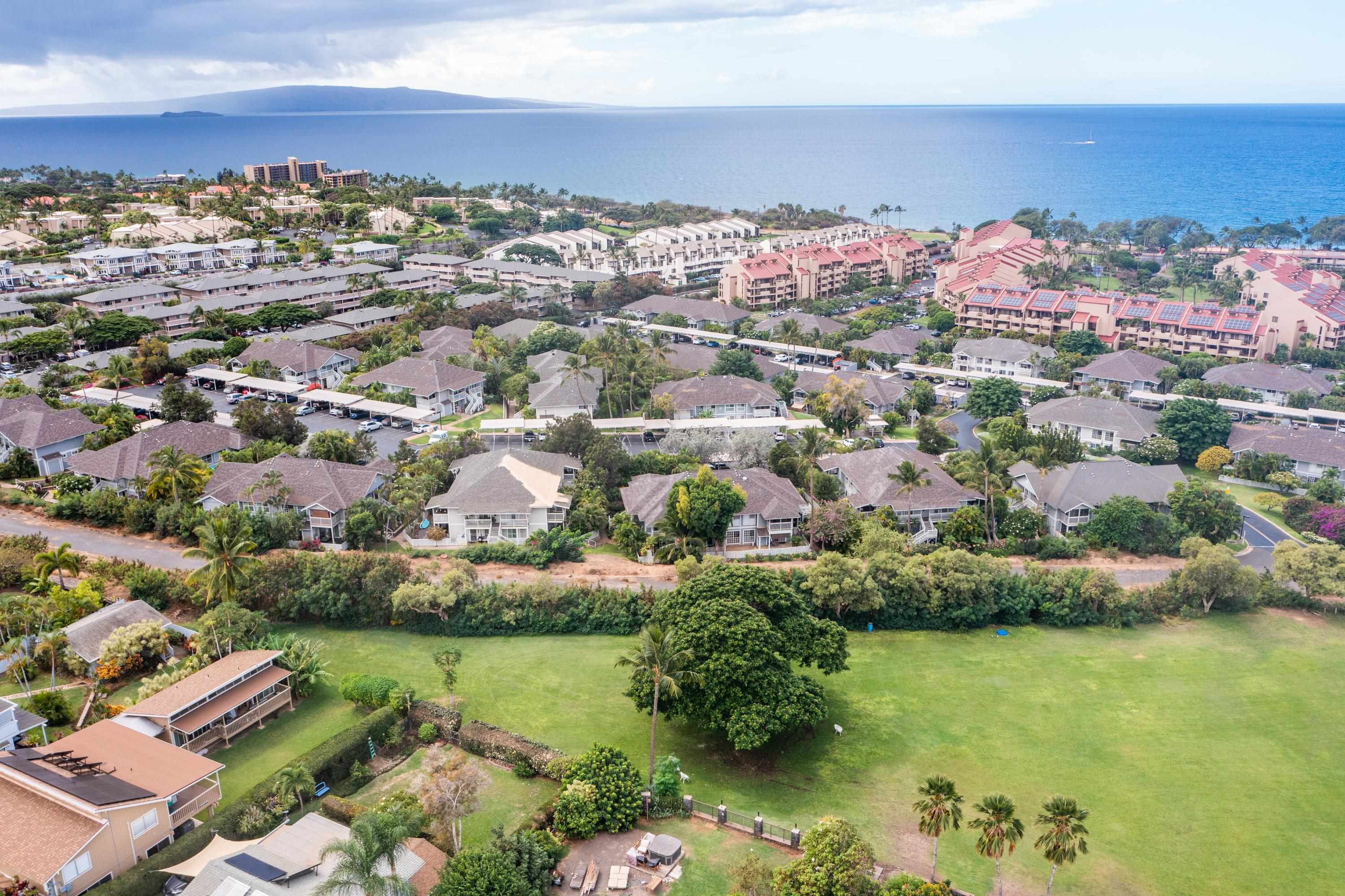 160 Keonekai Road, Unit 22201 Kihei, HI 96753 - Photo 36 of 37 an aerial view of residential houses with outdoor space