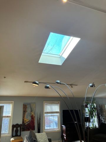 a view of a livingroom with furniture and windows