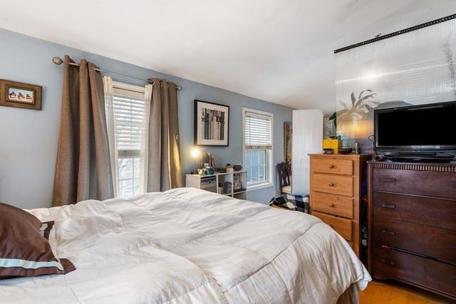 a bedroom with a bed and furniture