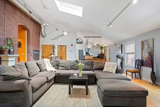 a living room with furniture and a couch