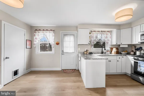 a kitchen with sink and window