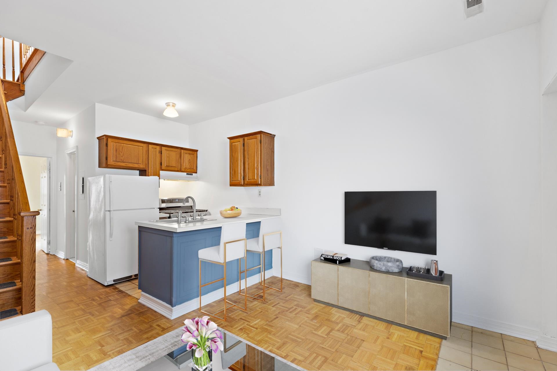 82 Jackson Street, Unit B5 Hoboken, NJ 07030 - Photo 2 of 14 a living room with furniture and a flat screen tv