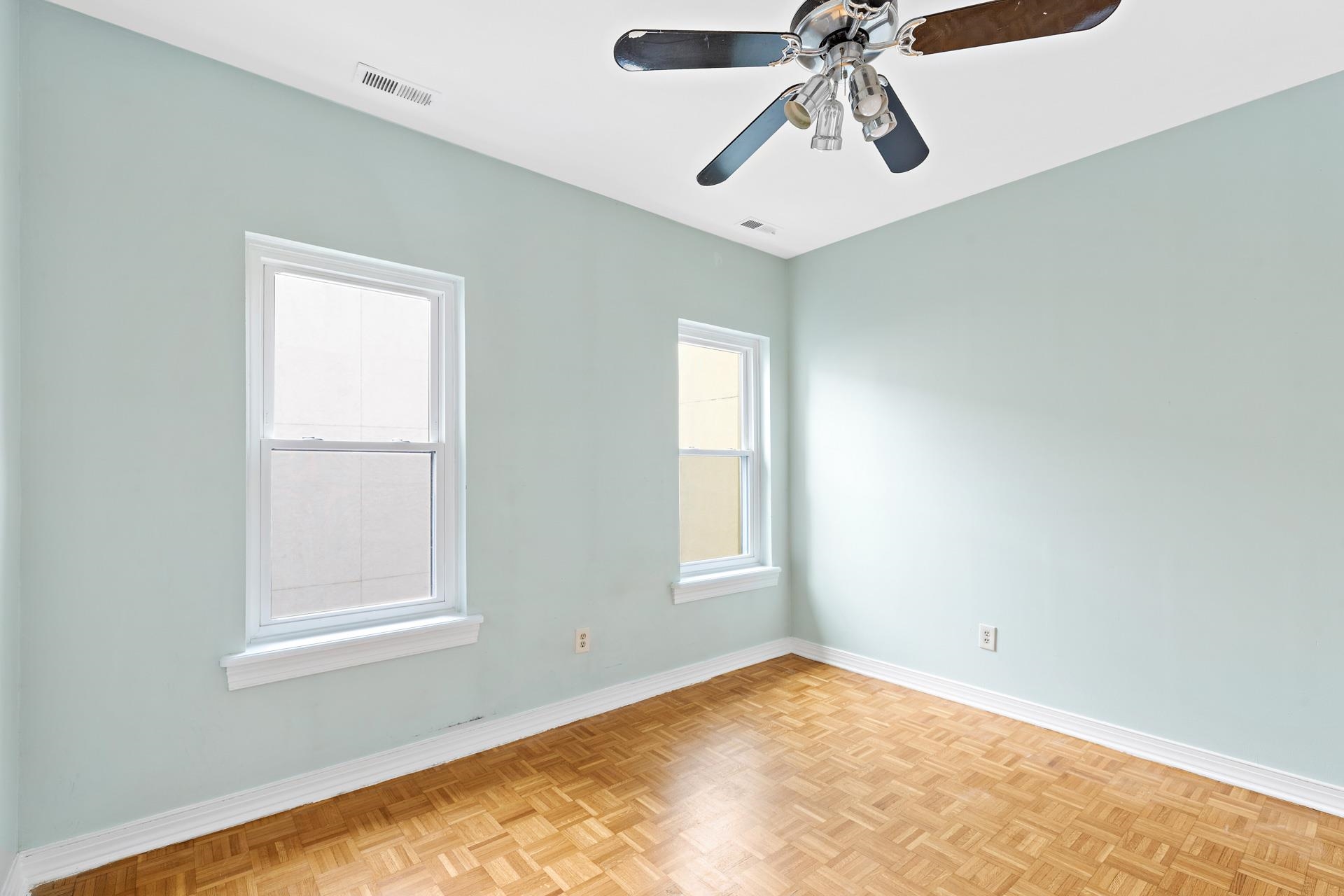 82 Jackson Street, Unit B5 Hoboken, NJ 07030 - Photo 9 of 14 a view of empty room with window and ceiling fan
