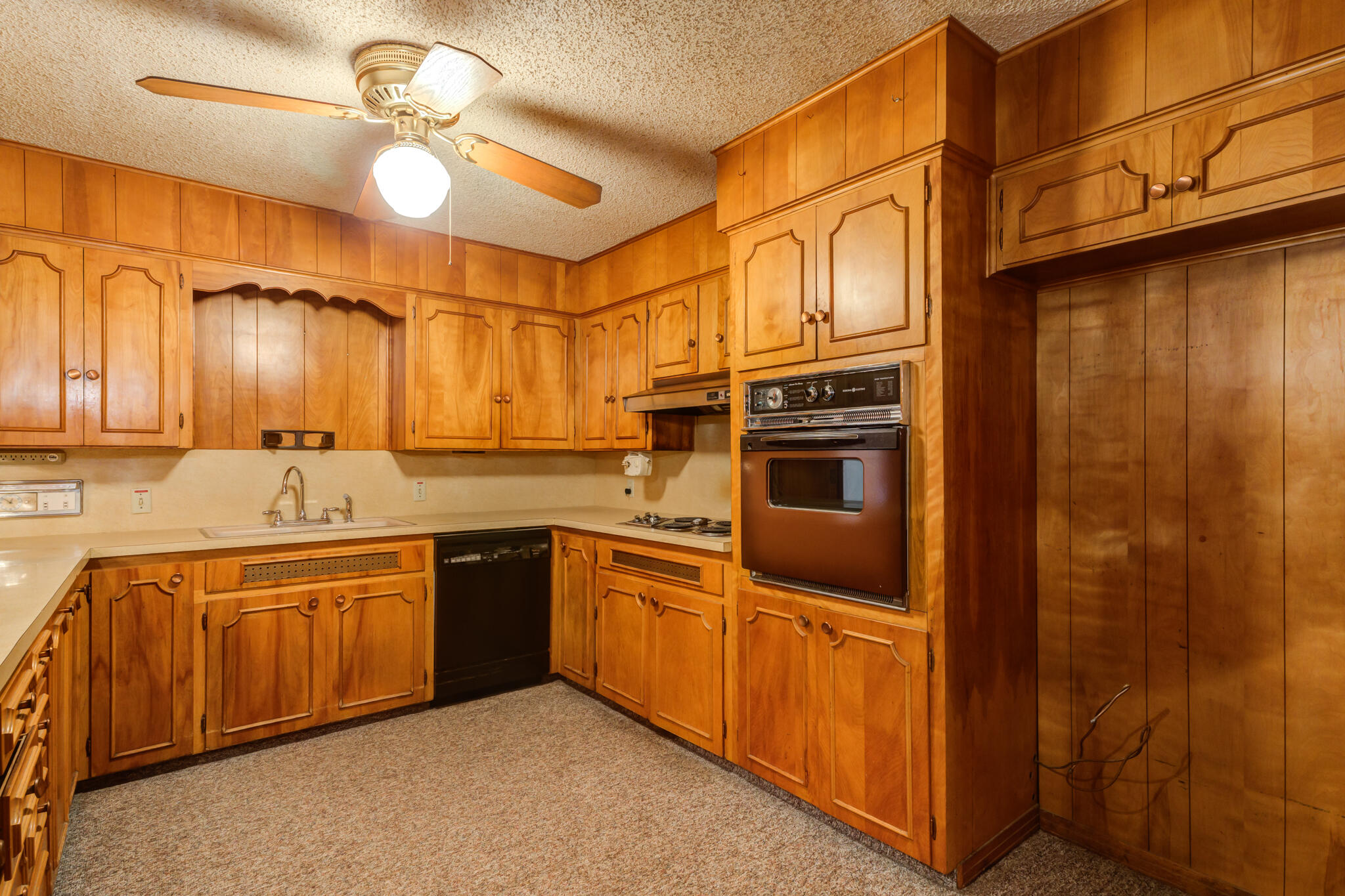 111 East 13th Street Littlefield, TX 79339 - Photo 11 of 38 a kitchen with stainless steel appliances granite countertop a sink and cabinets