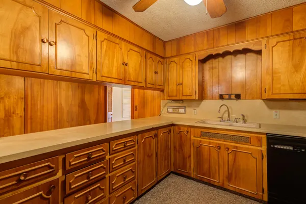 a kitchen with a sink and cabinets