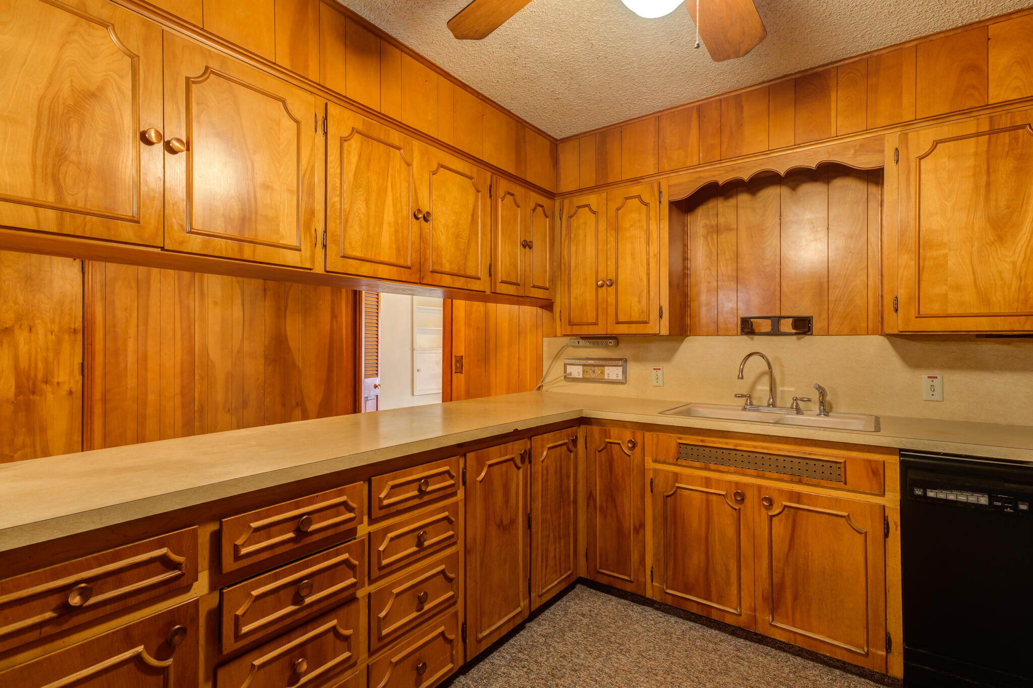 111 East 13th Street Littlefield, TX 79339 - Photo 13 of 38 a kitchen with a sink and cabinets