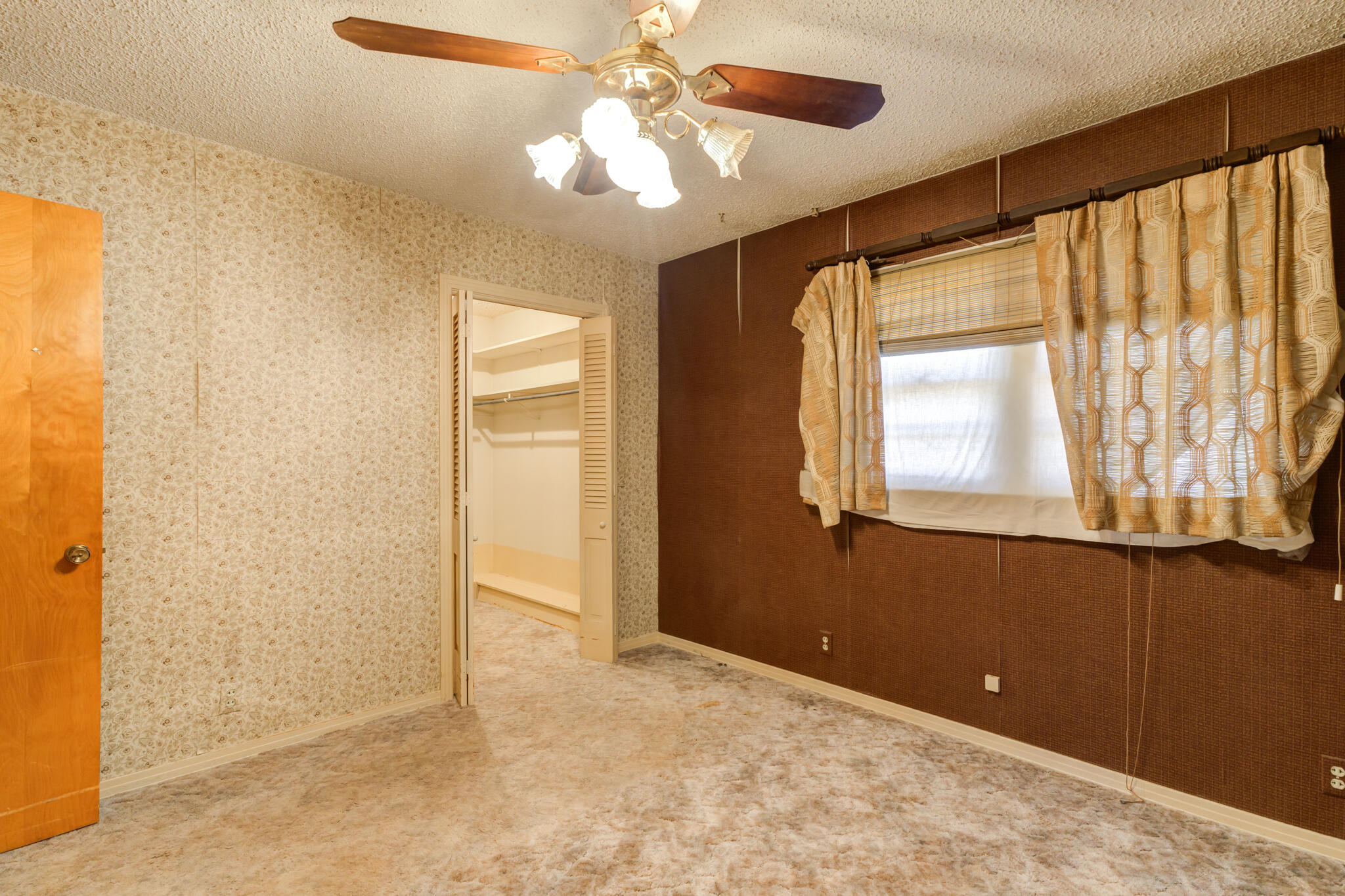 111 East 13th Street Littlefield, TX 79339 - Photo 20 of 38 a view of an empty room with window and chandelier fan