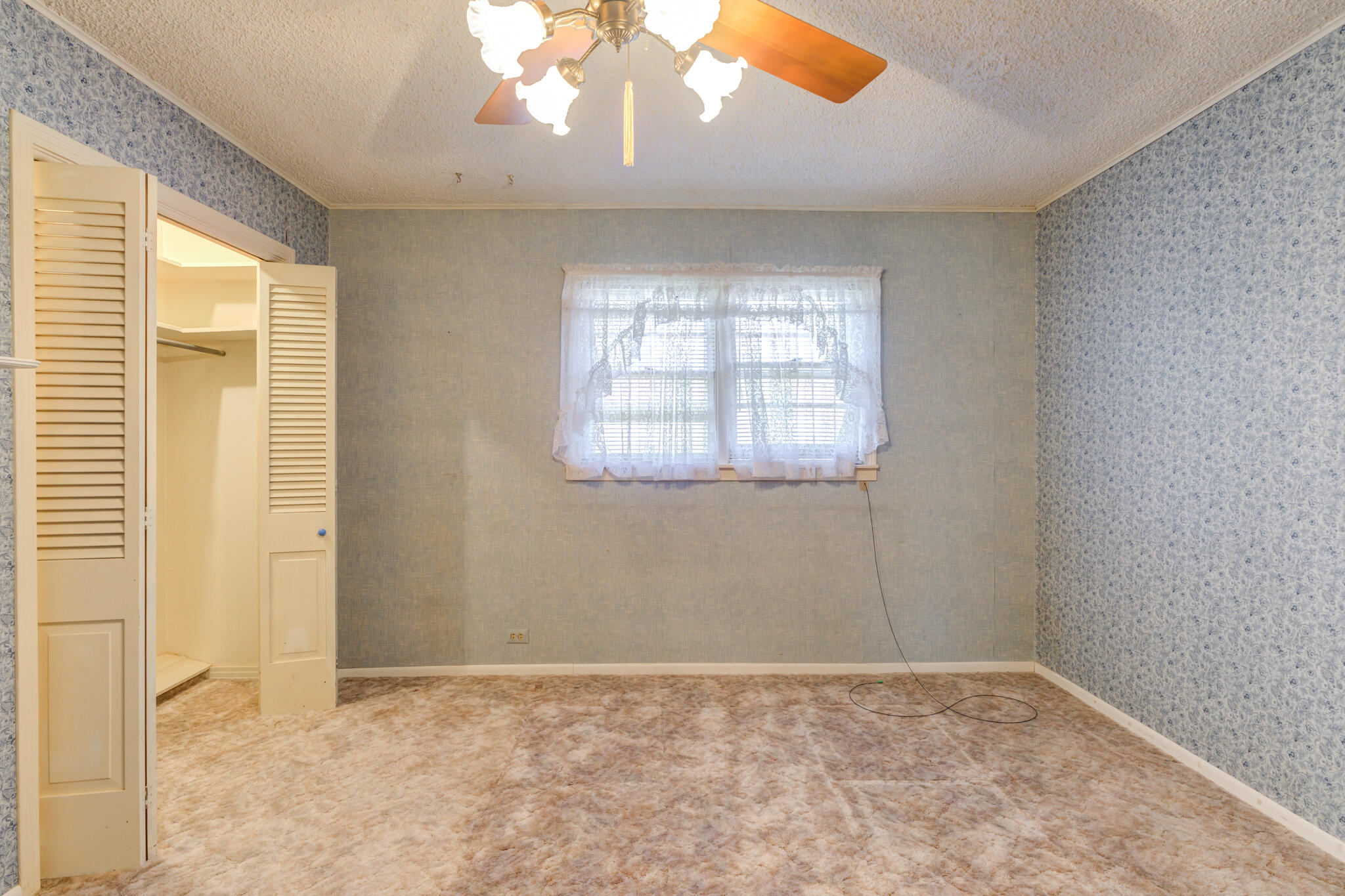 111 East 13th Street Littlefield, TX 79339 - Photo 29 of 38 an empty room with a window