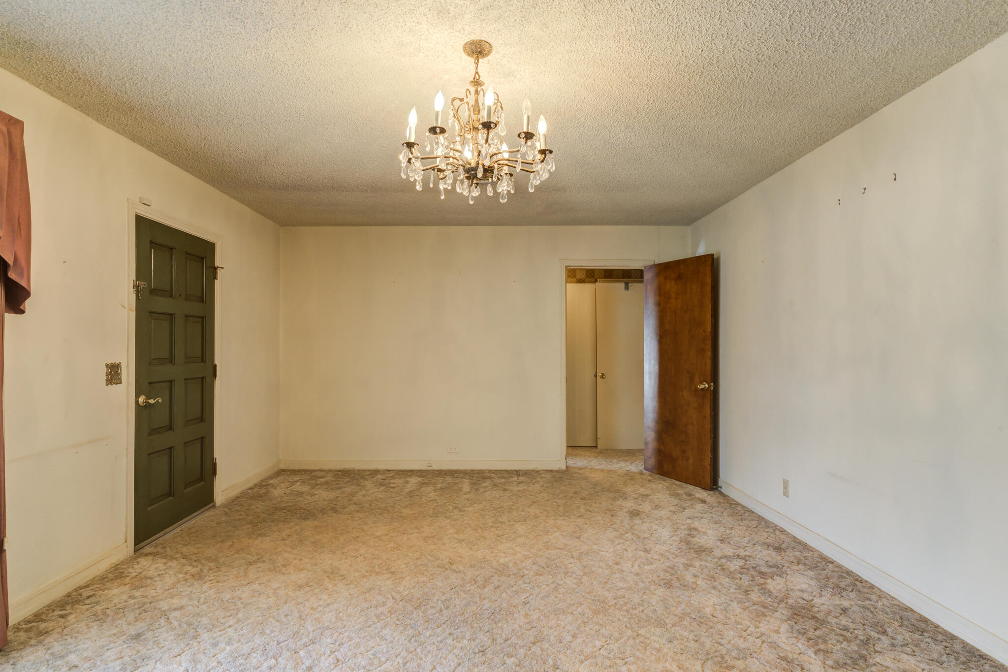 111 East 13th Street Littlefield, TX 79339 - Photo 8 of 38 a view of a chandelier in big room