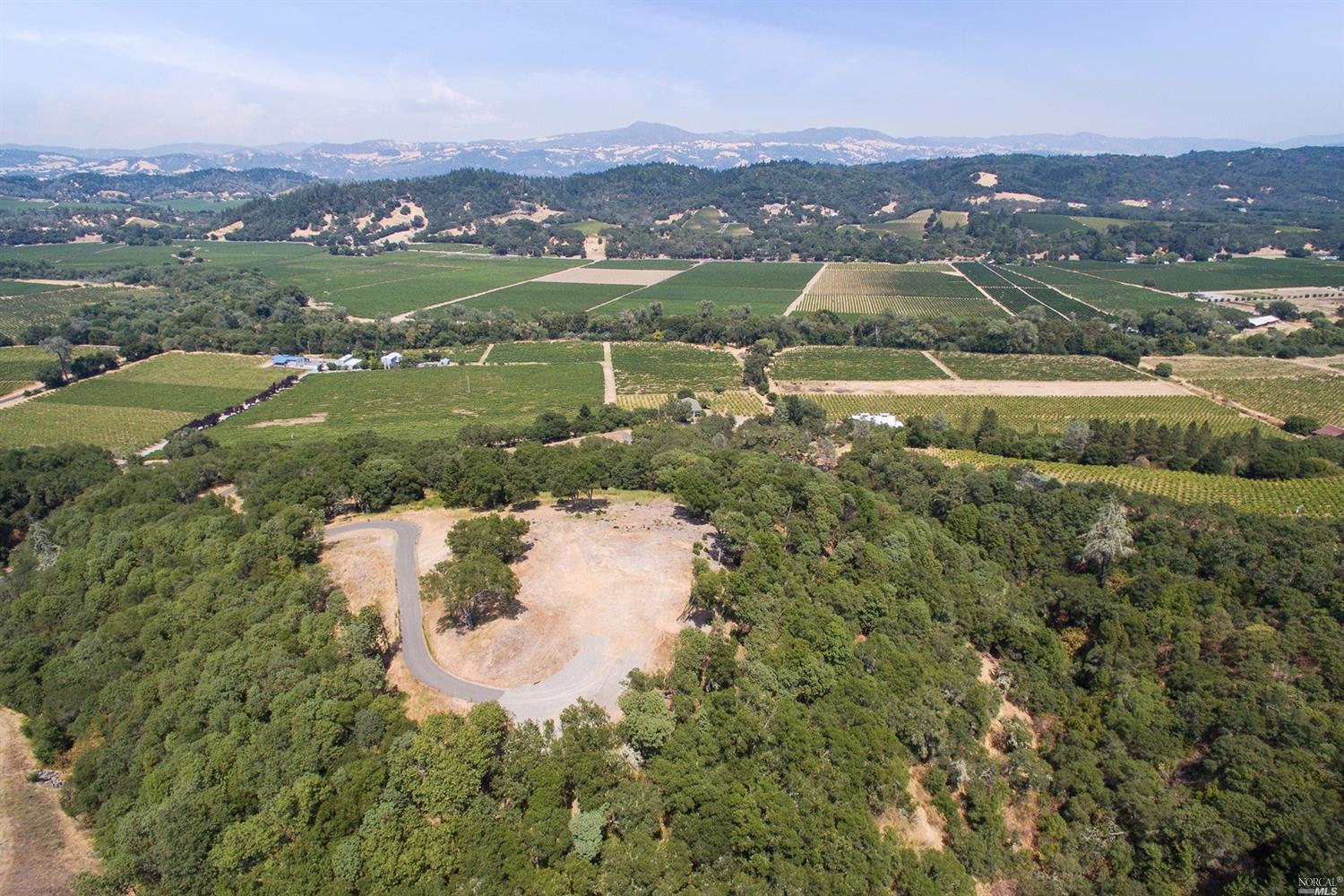 7455 West Dry Creek Road Healdsburg, CA 95448 - Photo 1 of 1 an aerial view of a house with a lake view