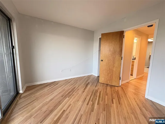 a view of a hallway with washer and dryer