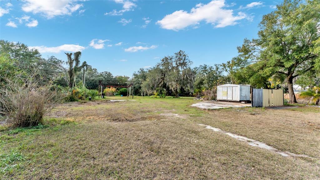 23 Violet Street Plant City, FL 33563 - Photo 1 of 13 a view of a field with tree s