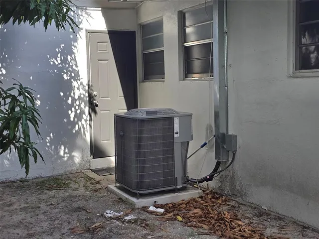 a view of a house with backyard porch and sitting area