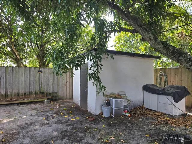 a view of a yard with a tree