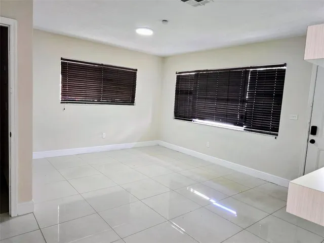 a view of an empty room with a window