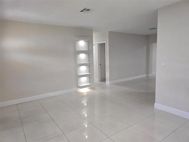 a view of an empty room and window