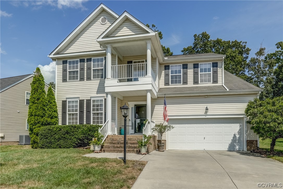 2407 Cascade Meadows Drive Midlothian, VA 23112 - Photo 1 of 48 a front view of a house with a yard