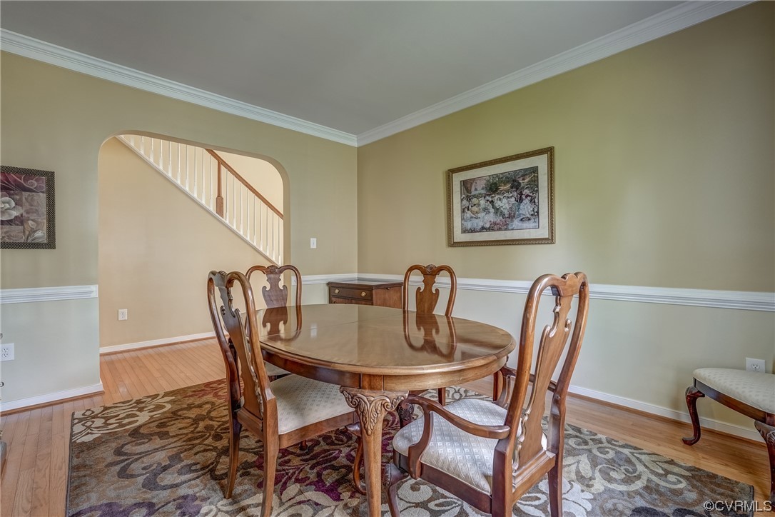 2407 Cascade Meadows Drive Midlothian, VA 23112 - Photo 12 of 48 a view of a dining room with furniture and wooden floor