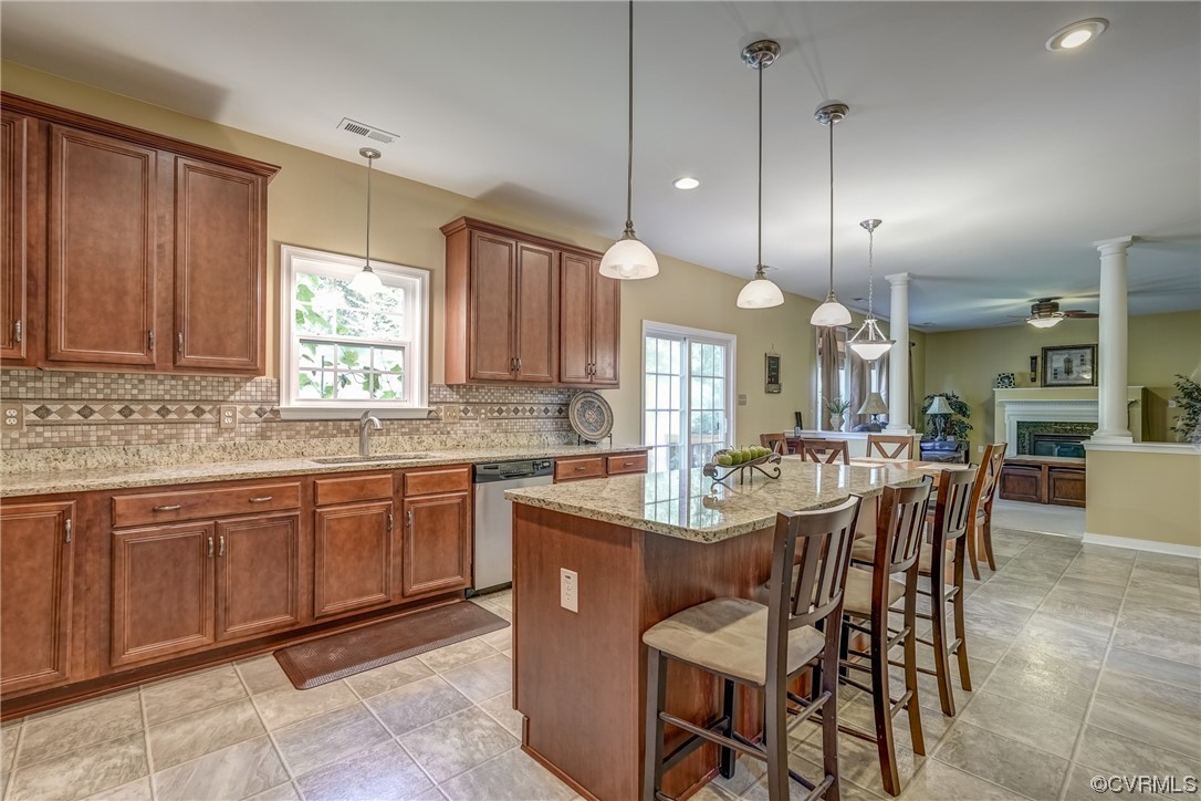 2407 Cascade Meadows Drive Midlothian, VA 23112 - Photo 17 of 48 a large kitchen with a table and chairs in it