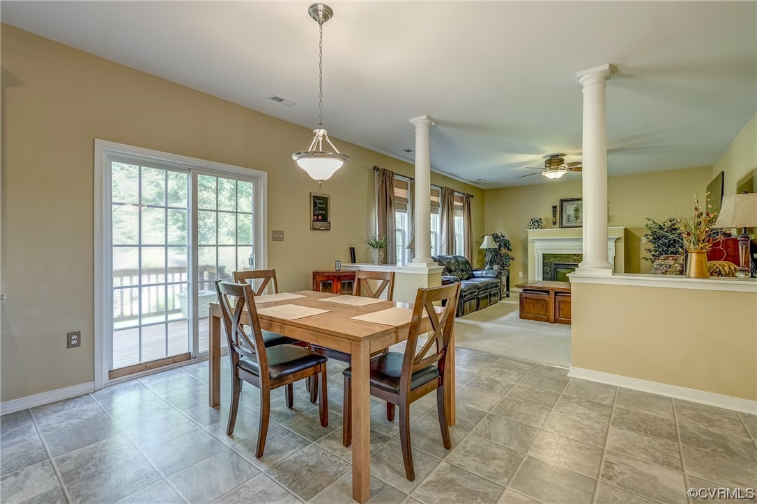 2407 Cascade Meadows Drive Midlothian, VA 23112 - Photo 21 of 48 a view of a dining room and livingroom with furniture wooden floor a chandelier