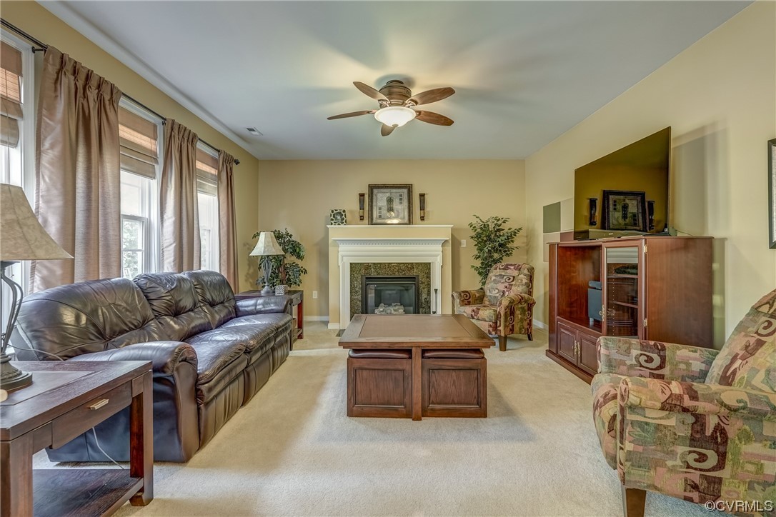 2407 Cascade Meadows Drive Midlothian, VA 23112 - Photo 22 of 48 a living room with furniture and a fireplace