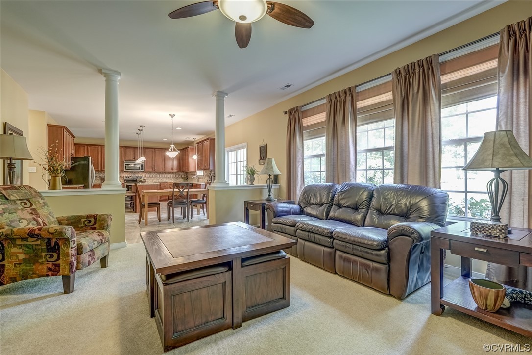 2407 Cascade Meadows Drive Midlothian, VA 23112 - Photo 24 of 48 a living room with furniture and a large window