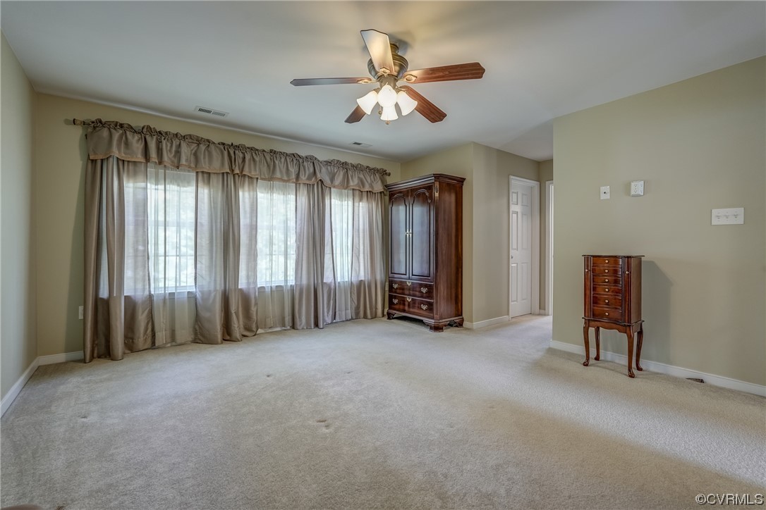 2407 Cascade Meadows Drive Midlothian, VA 23112 - Photo 29 of 48 an empty room with windows and fan
