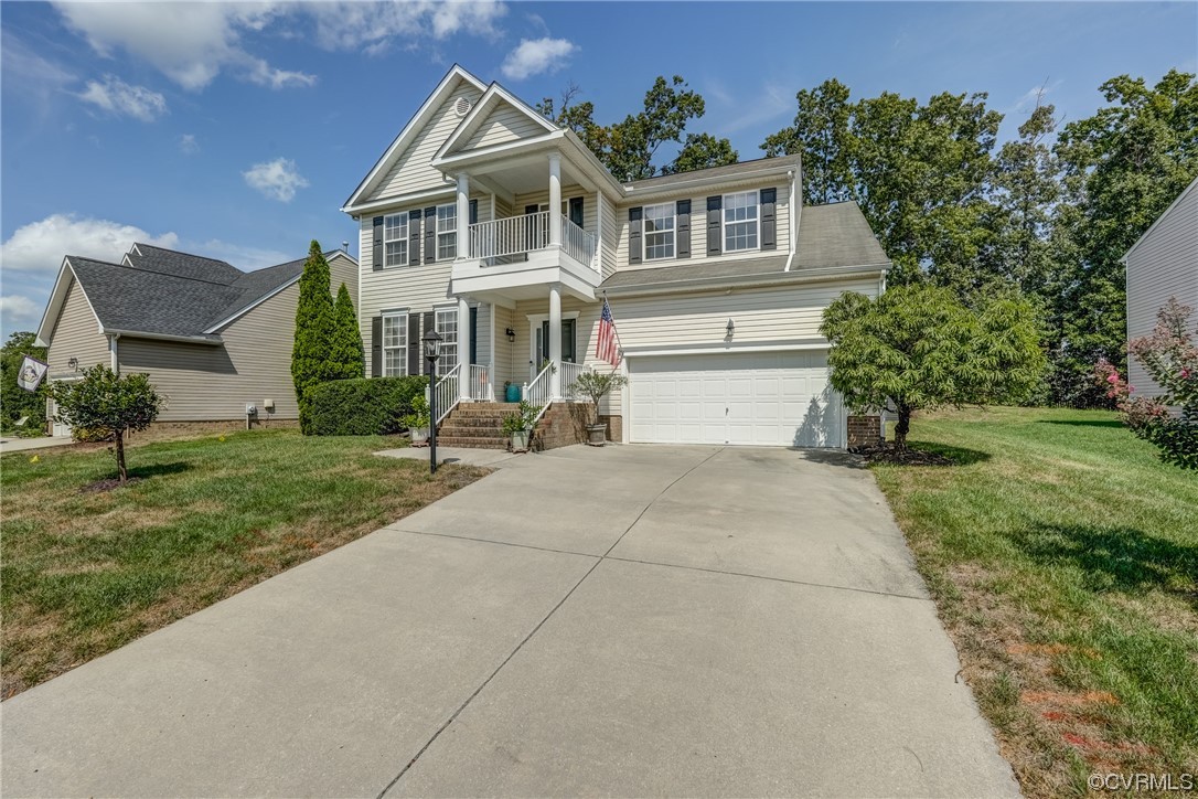 2407 Cascade Meadows Drive Midlothian, VA 23112 - Photo 3 of 48 a front view of a house with a yard