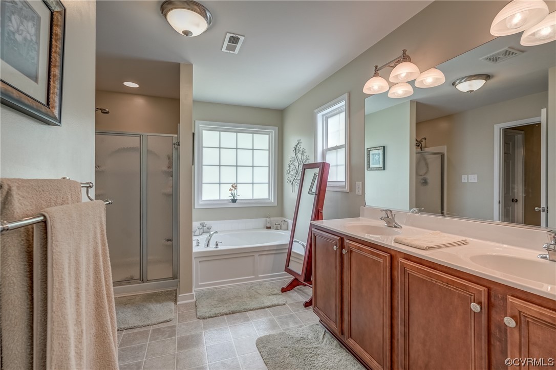 2407 Cascade Meadows Drive Midlothian, VA 23112 - Photo 33 of 48 a bathroom with a sink a vanity and a mirror