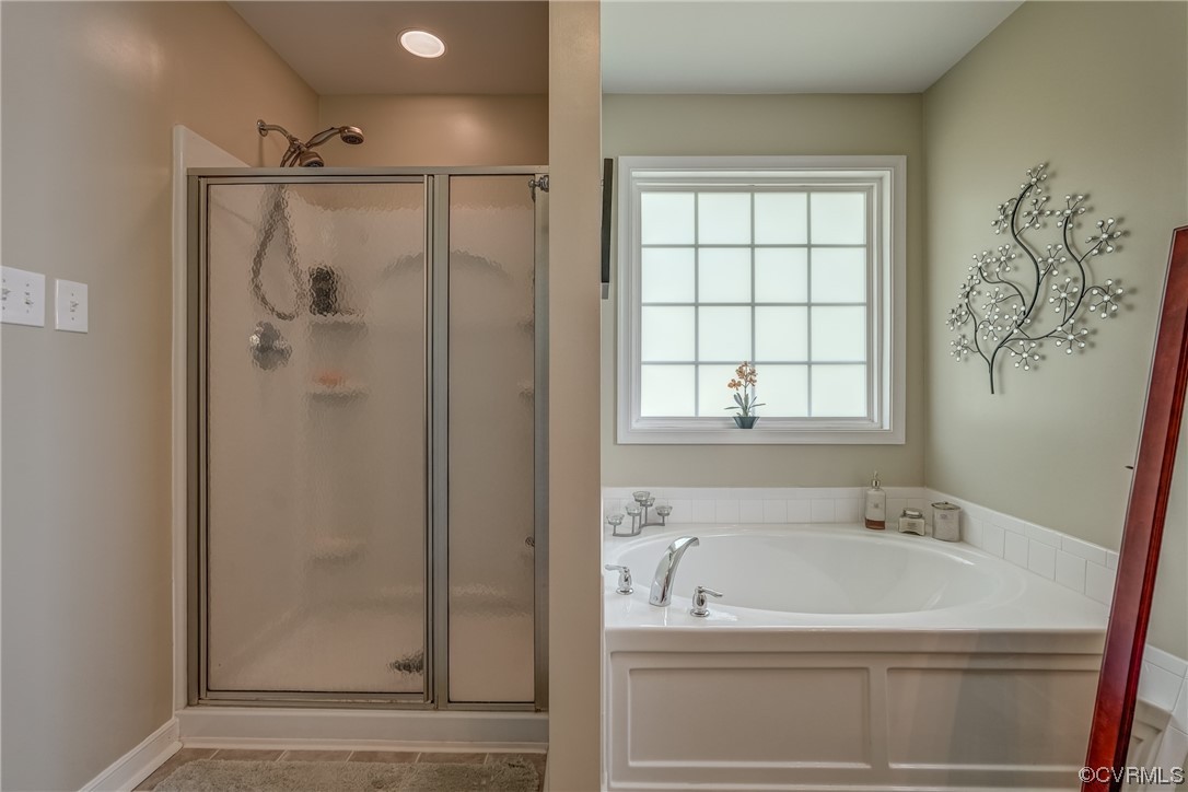 2407 Cascade Meadows Drive Midlothian, VA 23112 - Photo 34 of 48 a bathroom with a bathtub and a shower