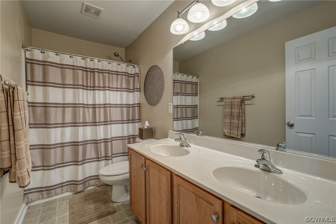 2407 Cascade Meadows Drive Midlothian, VA 23112 - Photo 37 of 48 a bathroom with a sink and a mirror
