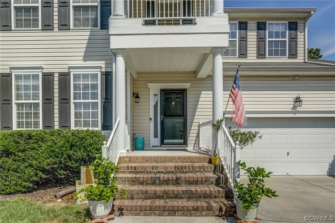 2407 Cascade Meadows Drive Midlothian, VA 23112 - Photo 4 of 48 a front view of a house with a garden