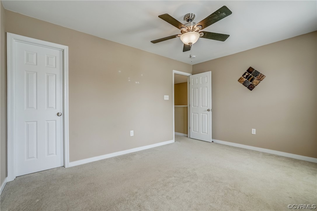 2407 Cascade Meadows Drive Midlothian, VA 23112 - Photo 41 of 48 an empty room with closet and a ceiling fan