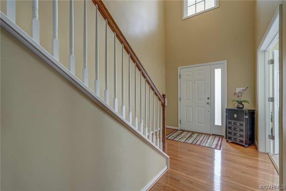 2407 Cascade Meadows Drive Midlothian, VA 23112 - Photo 5 of 48 a view of a hallway with wooden floor and staircase