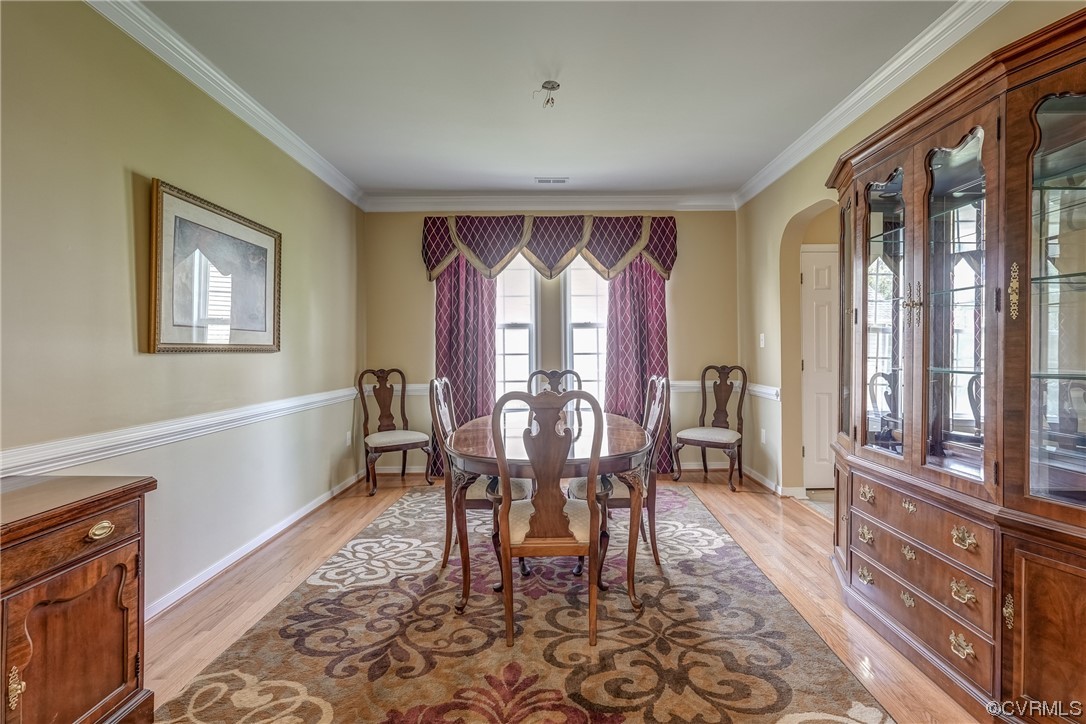 2407 Cascade Meadows Drive Midlothian, VA 23112 - Photo 10 of 48 a view of a dining room with furniture window and wooden floor