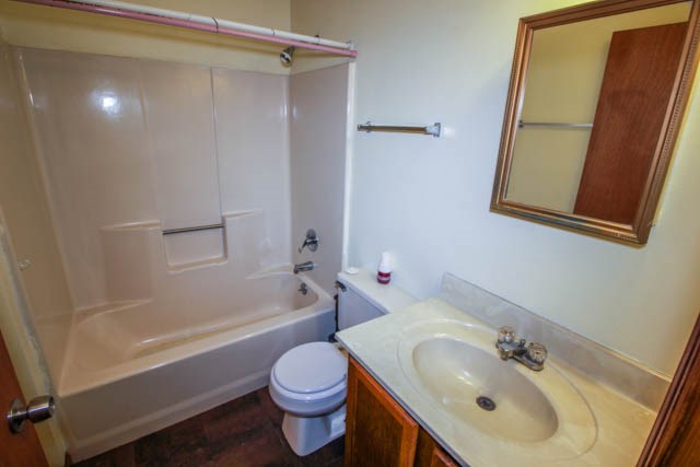 4 Broyles Road Phenix City, AL 36869 - Photo 11 of 15 a bathroom with a sink toilet and shower
