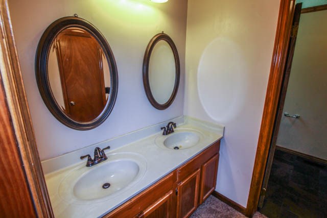 4 Broyles Road Phenix City, AL 36869 - Photo 14 of 15 a bathroom with a sink and a mirror