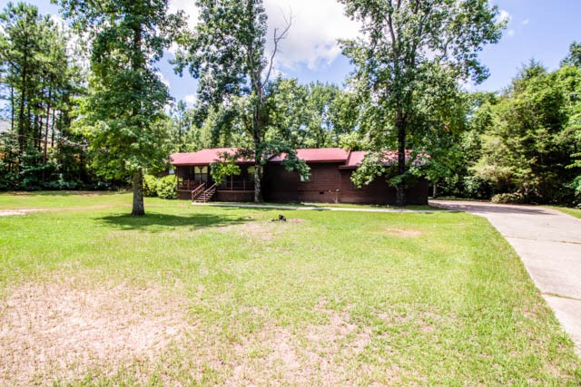 4 Broyles Road Phenix City, AL 36869 - Photo 2 of 15 a view of a garden with swimming pool