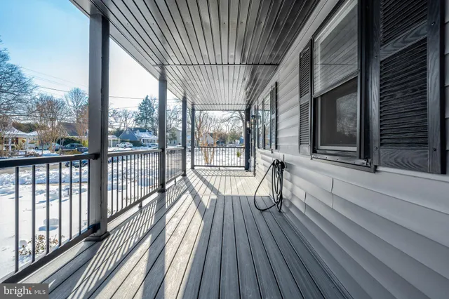 a view of a balcony with wooden floor