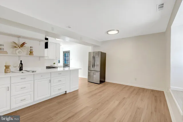 a view of a storage & utility room with a sink