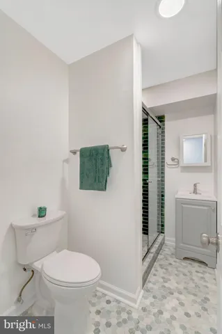 a view of an empty room and wooden floor