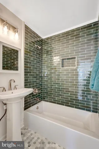 a view of an empty room and wooden floor