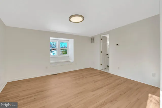 a bathroom with a toilet and shower