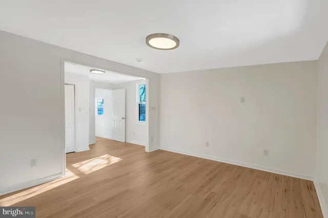 a view of hallway with wooden floor