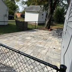 a view of a house with a snow in front of yard