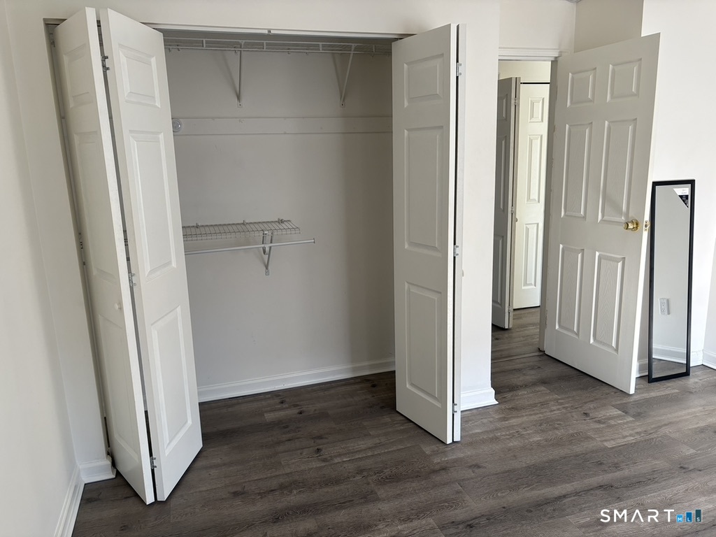 12 Tuttle Street, Unit 1C Stamford, CT 06902 - Photo 9 of 14 a view of a small space with wooden floor and entrance